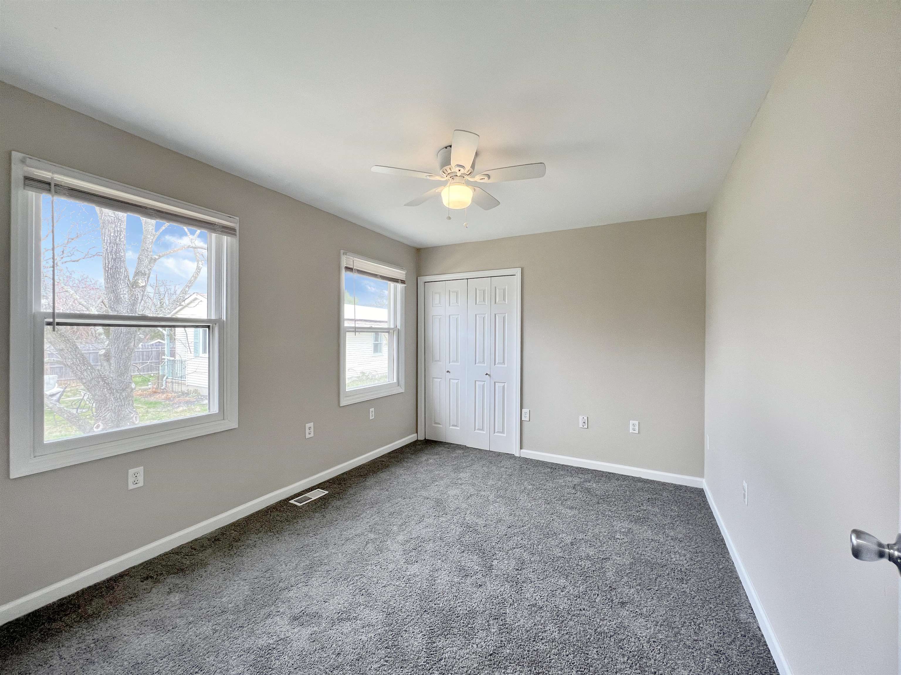 2117 Highway 50 Tuckahoe, NJ 08270 - Photo 11 of 23 an empty room with chandelier fan and windows