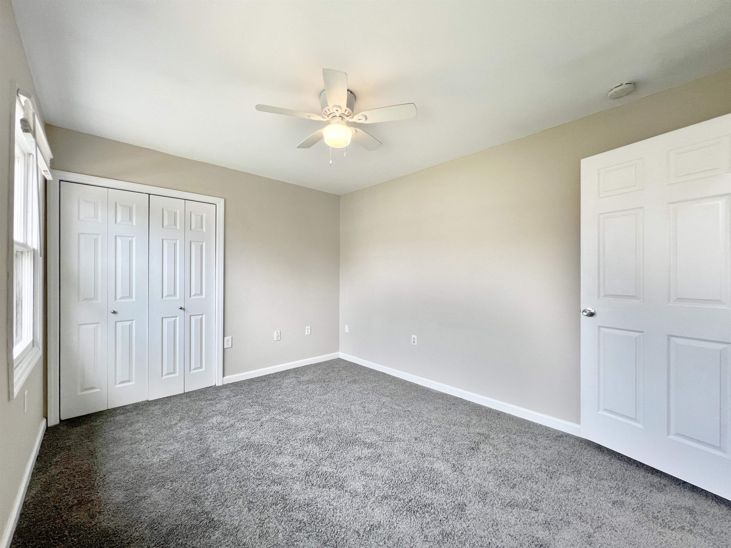 2117 Highway 50 Tuckahoe, NJ 08270 - Photo 12 of 23 an empty room with a ceiling fan and a window