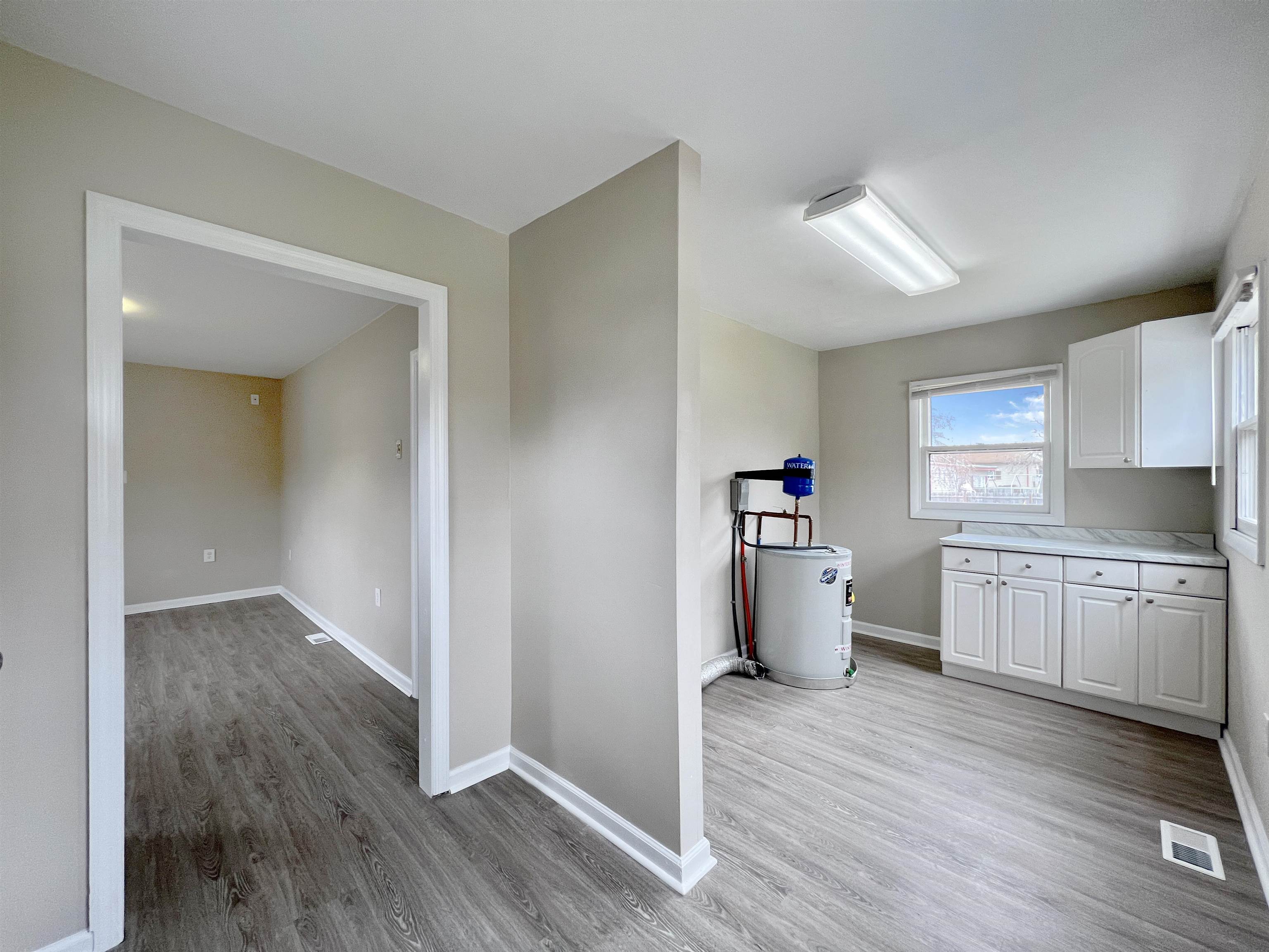 2117 Highway 50 Tuckahoe, NJ 08270 - Photo 21 of 23 a kitchen with a sink and wooden floor