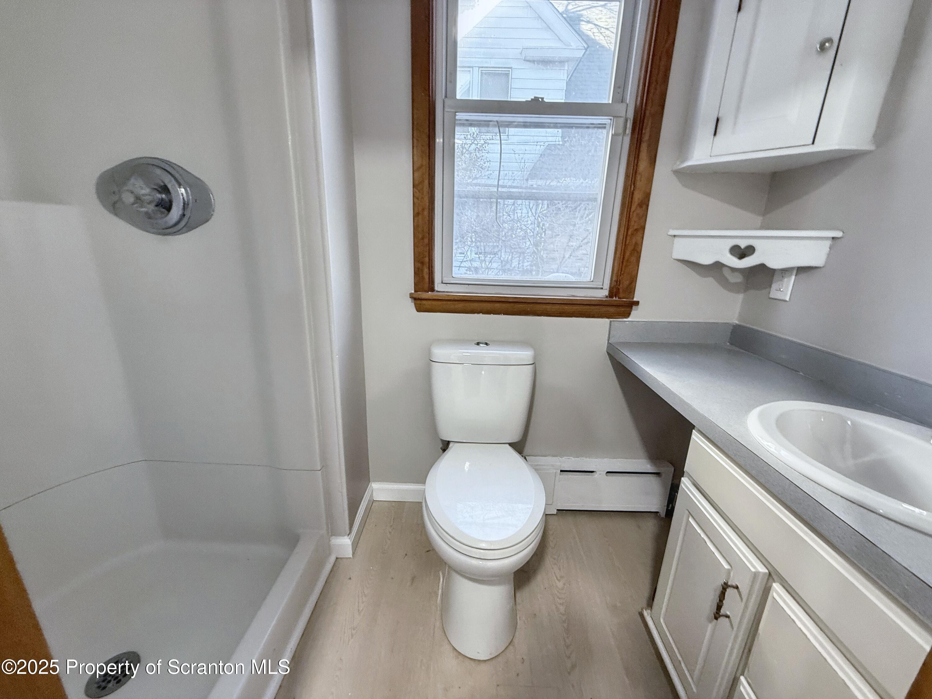 1513 15 Myrtle Street Scranton, PA 18510 - Photo 12 of 22 a bathroom with a sink toilet and shower