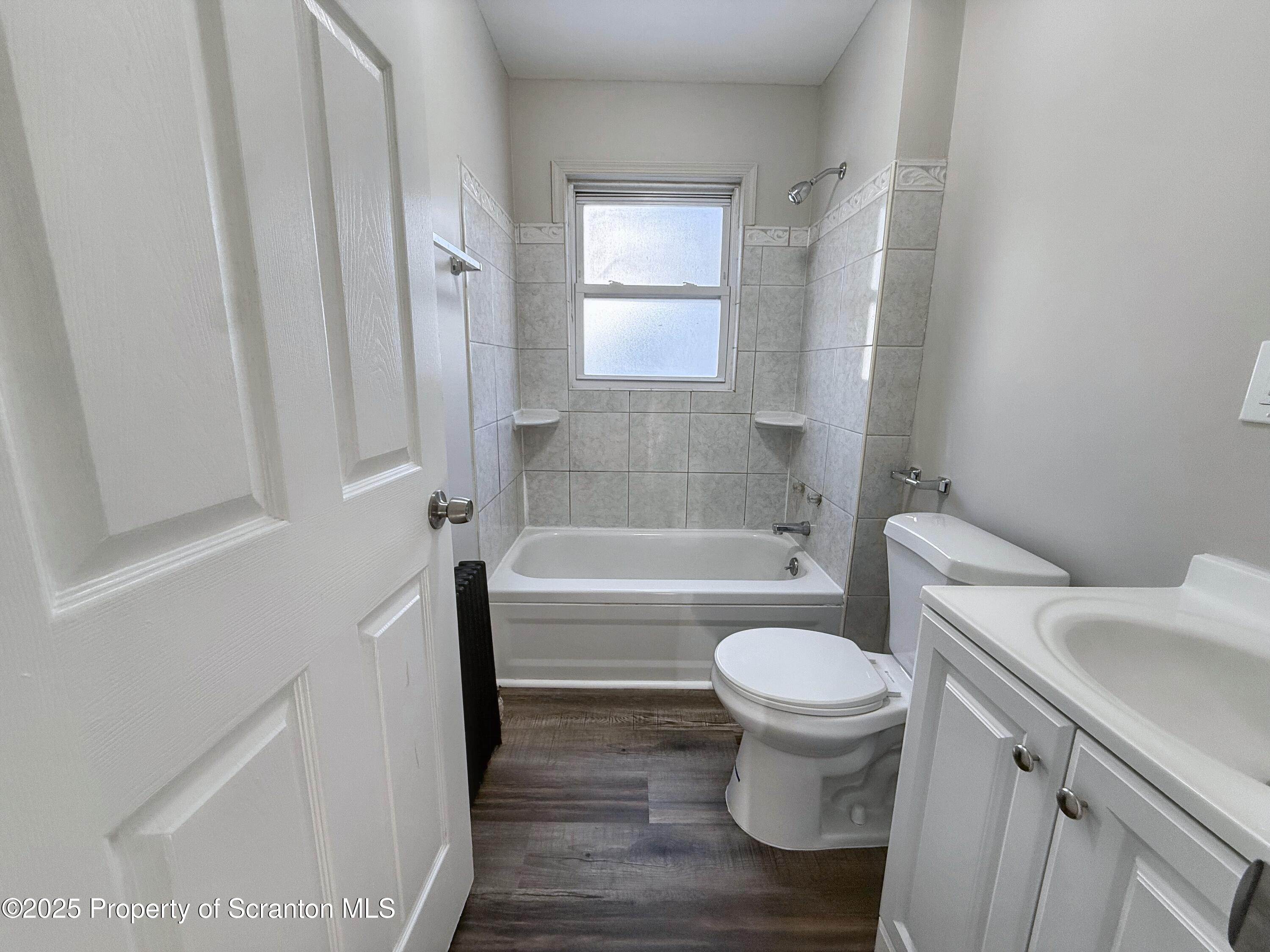 1513 15 Myrtle Street Scranton, PA 18510 - Photo 17 of 22 a bathroom with a toilet and a tub