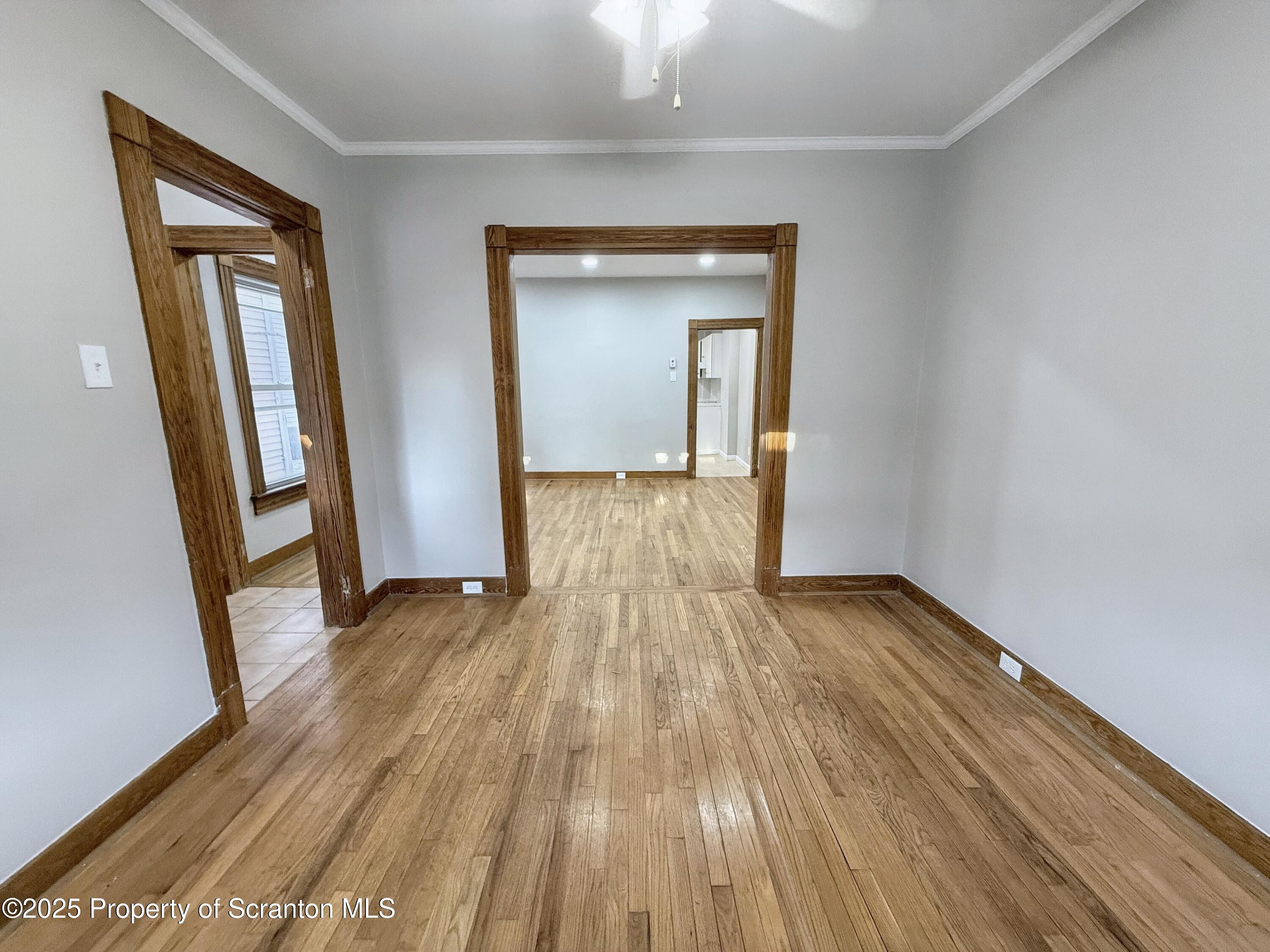 1513 15 Myrtle Street Scranton, PA 18510 - Photo 4 of 22 a view of a room with wooden floor and staircase