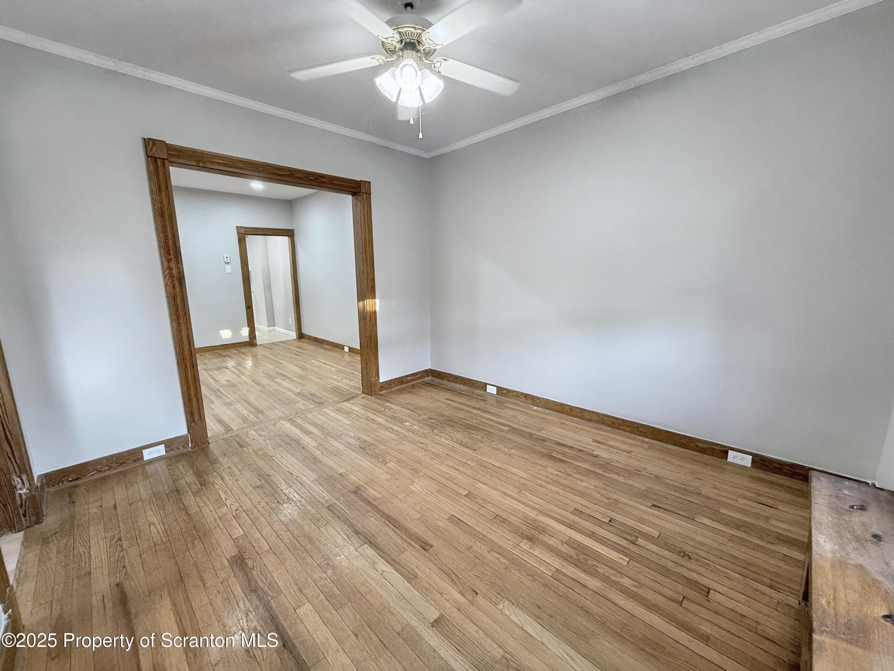 1513 15 Myrtle Street Scranton, PA 18510 - Photo 7 of 22 wooden floor in an empty room with a window