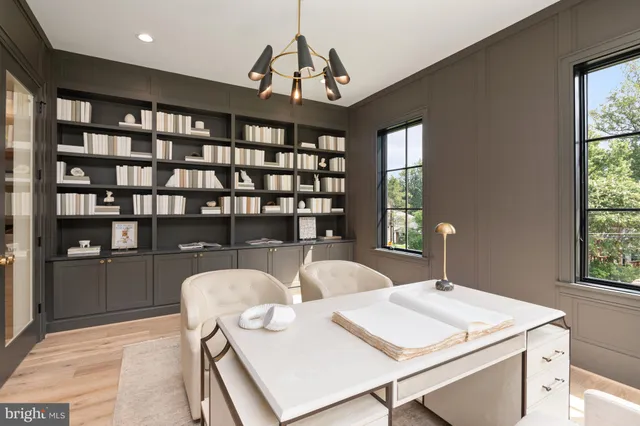 a view of a dining room with furniture and window