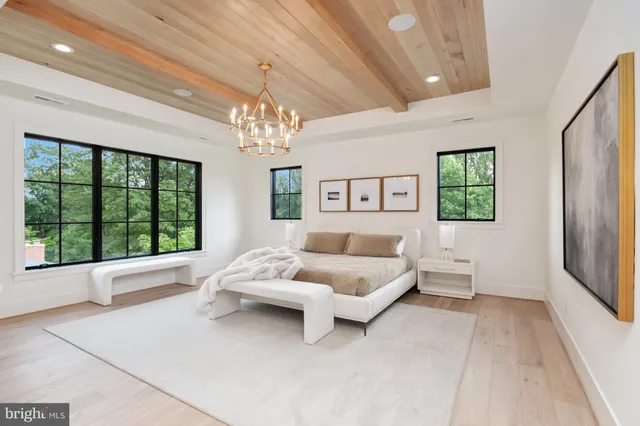 a spacious bedroom with a large bed and a couch