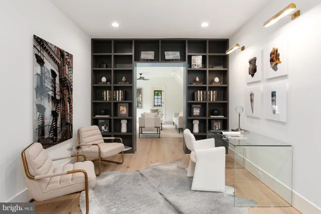 a living room with furniture a shelf and a book shelf