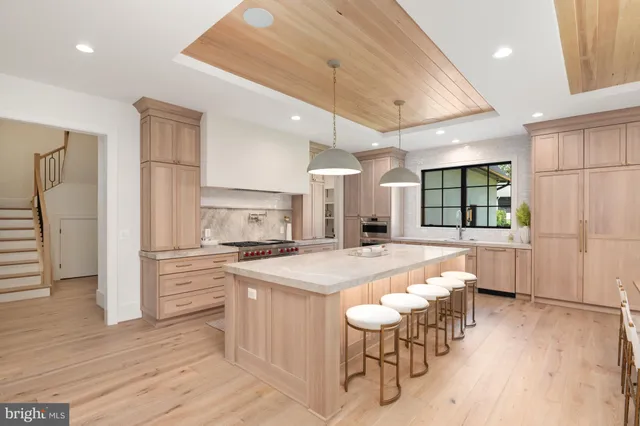 a kitchen with stainless steel appliances granite countertop a stove and refrigerator