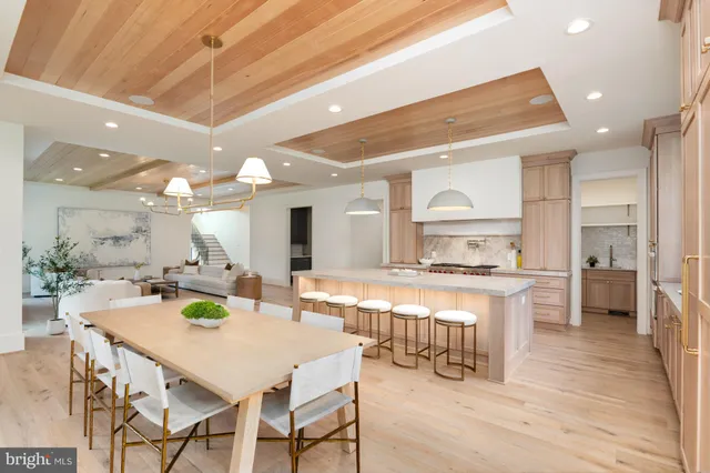 a large kitchen with a table and chairs