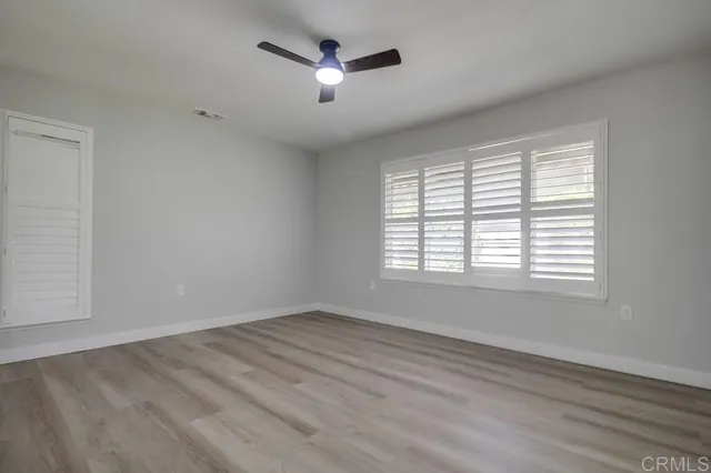 a bathroom with a double vanity sink mirror and shower