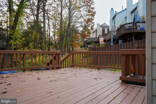 a view of a house with wooden deck