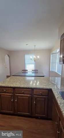 a view of kitchen and wooden floor