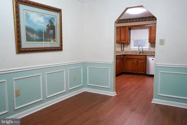 a room with a workspace and a window