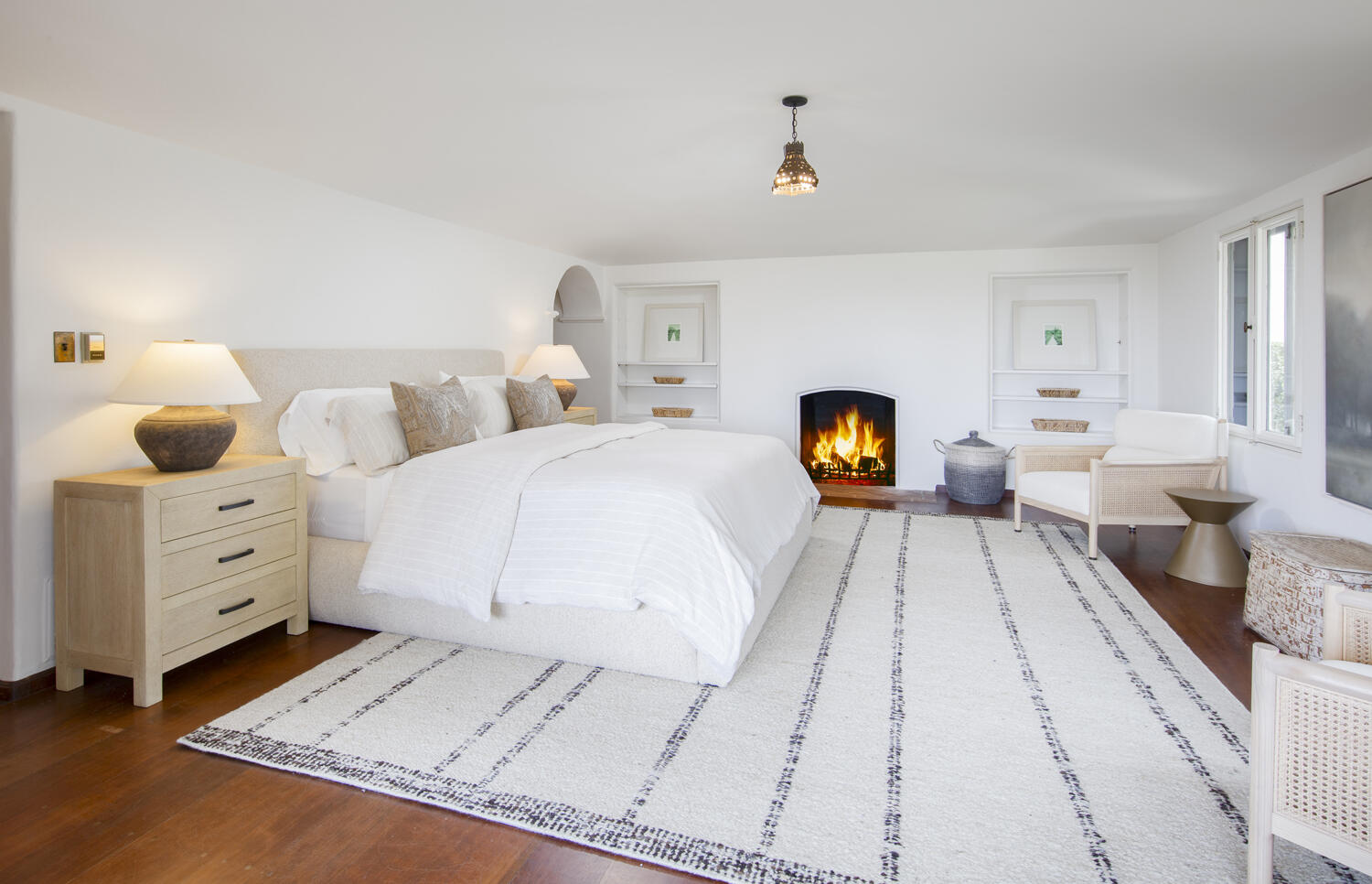 680 Buena Vista Drive Montecito, CA 93108 - Photo 11 of 33 a bedroom with a large bed and a lamp on dresser