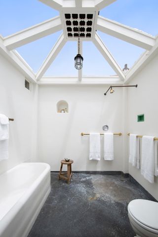 a bathroom with a sink a toilet and a bathtub