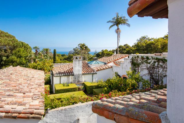 a view of a chairs and table in patio
