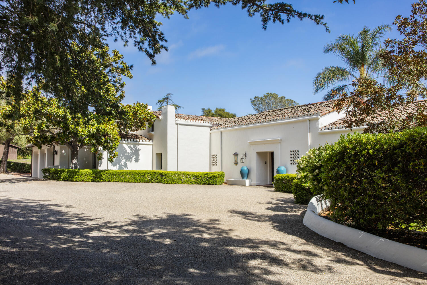 680 Buena Vista Drive Montecito, CA 93108 - Photo 32 of 33 a white house with a yard and a large tree