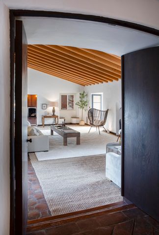 a view of living room with furniture and floor