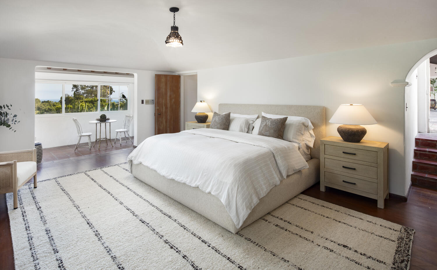 680 Buena Vista Drive Montecito, CA 93108 - Photo 9 of 33 a large white bed in a bedroom and a balcony