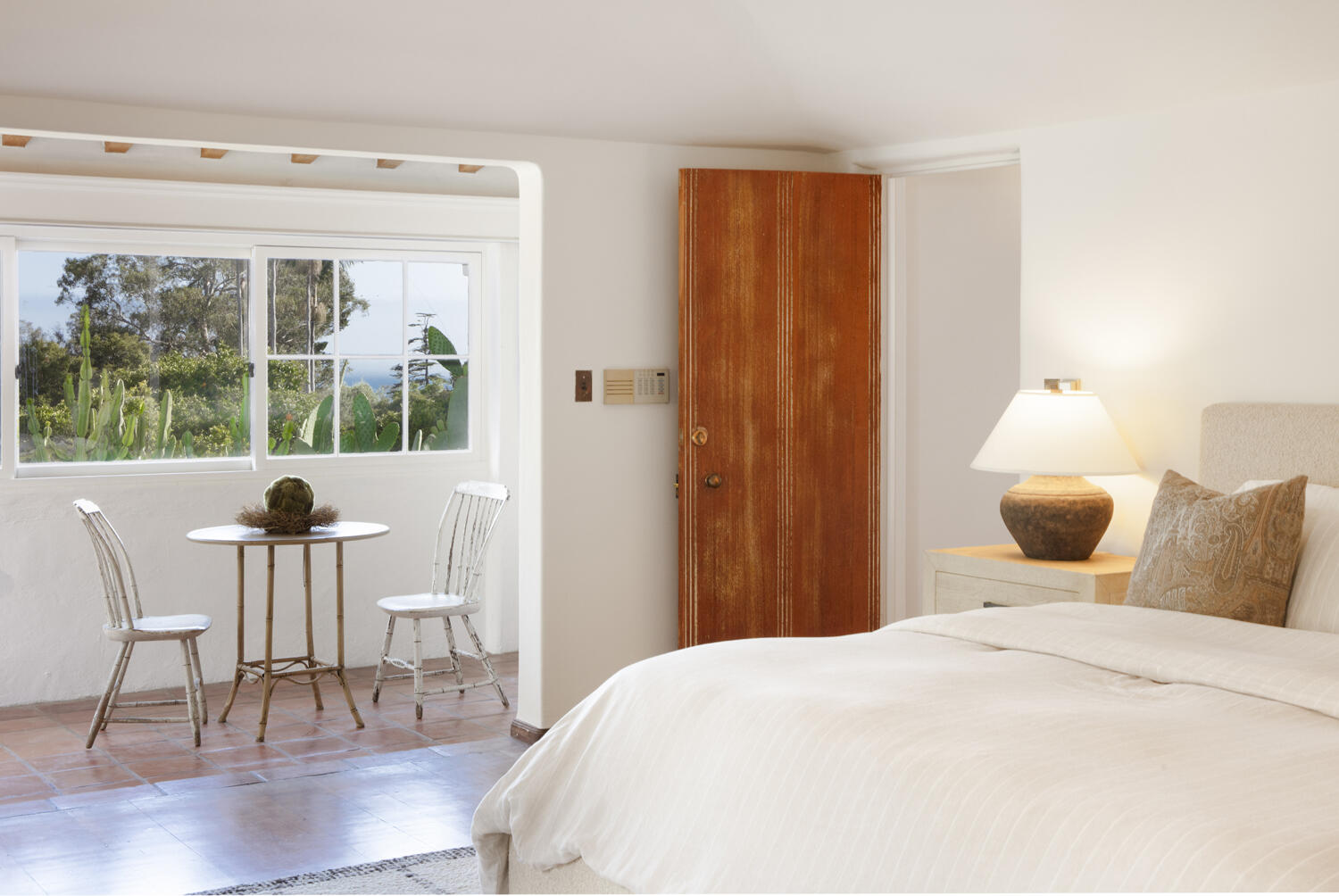 680 Buena Vista Drive Montecito, CA 93108 - Photo 10 of 33 a bedroom with a bed and wooden floor