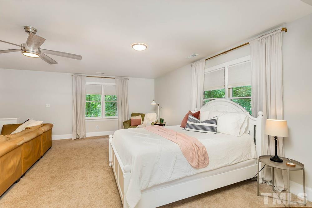 705 Presnell Court Raleigh, NC 27615 - Photo 12 of 30 a bedroom with a bed and a window