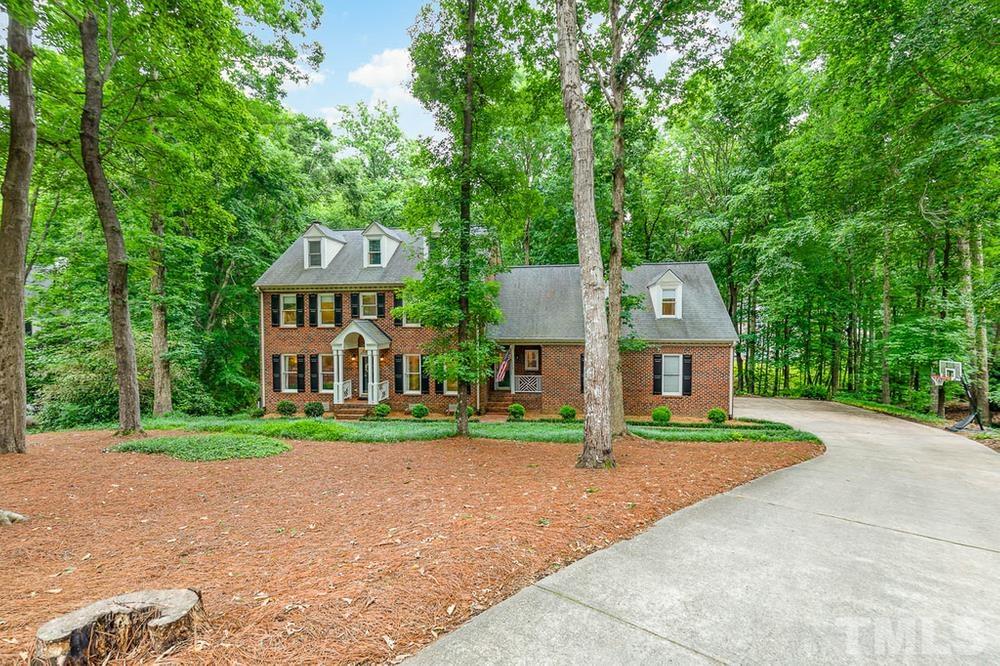 705 Presnell Court Raleigh, NC 27615 - Photo 2 of 30 a front view of a house with a yard and trees