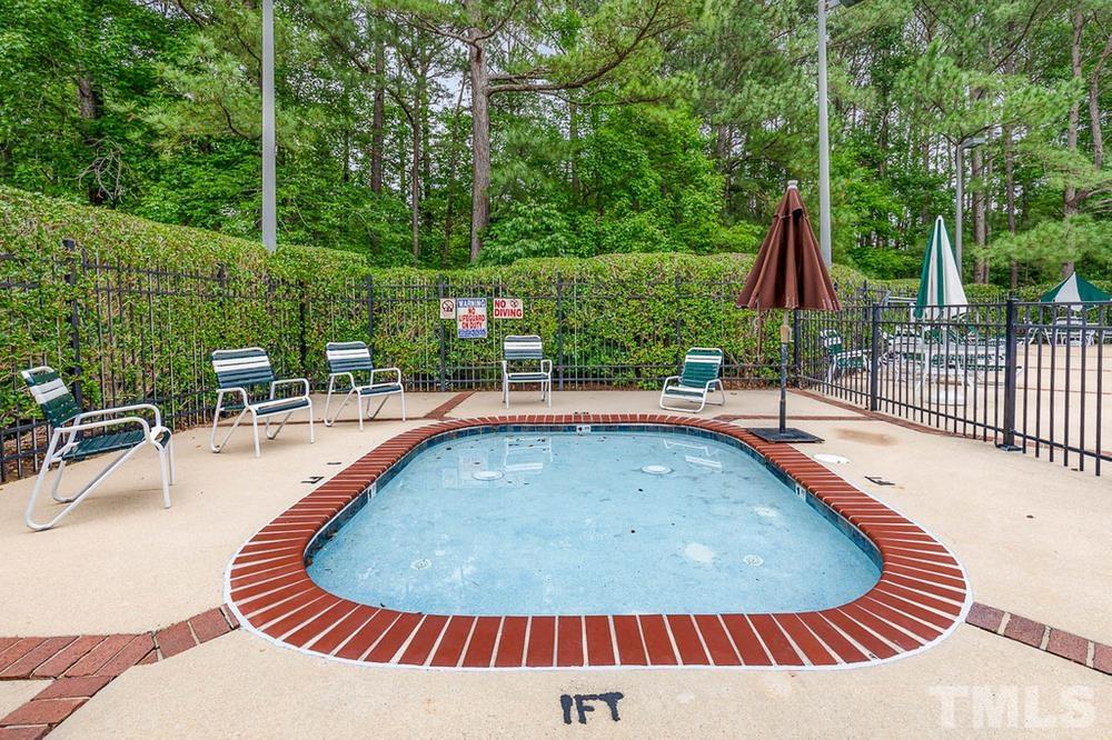 705 Presnell Court Raleigh, NC 27615 - Photo 29 of 30 a view of swimming pool with seating space