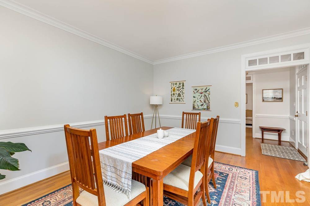 705 Presnell Court Raleigh, NC 27615 - Photo 7 of 30 a dining room with furniture and wooden floor