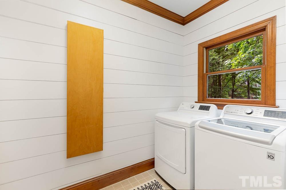 705 Presnell Court Raleigh, NC 27615 - Photo 9 of 30 a bathroom with a sink and a shower