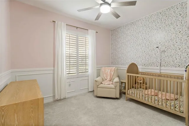 a view of a bedroom with furniture and staircase