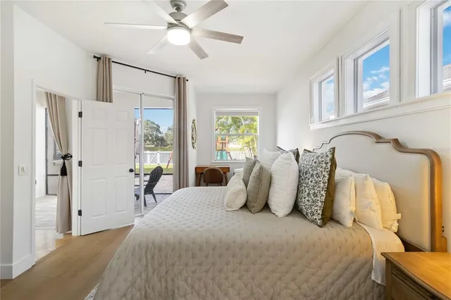 a bedroom with bed and a chandelier