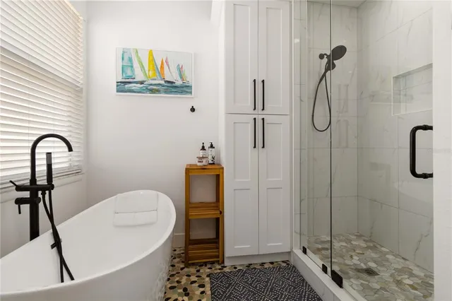 a view of a porch with furniture and a gate