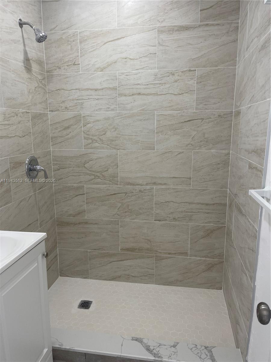 317 East 8th Street, Unit 1 Hialeah, FL 33010 - Photo 12 of 21 a bathroom with a shower