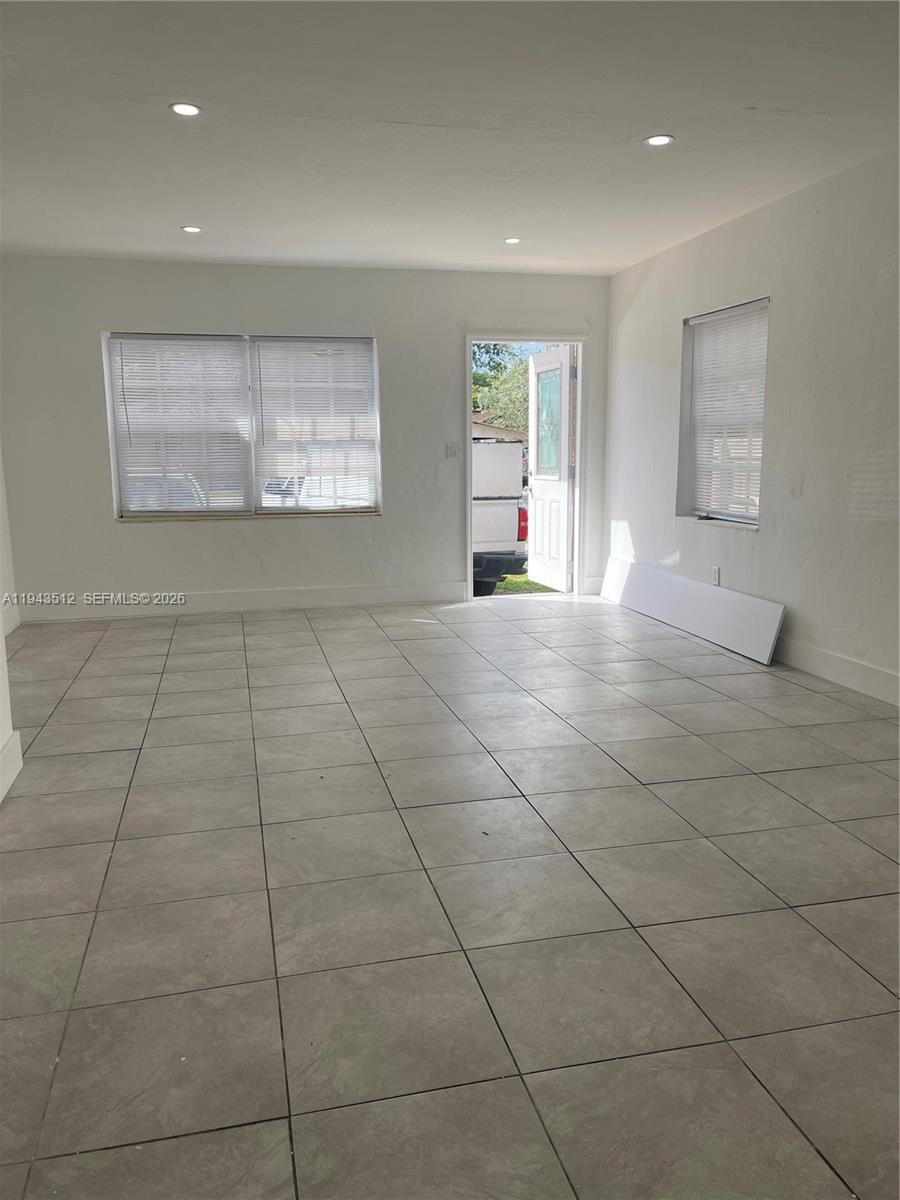 317 East 8th Street, Unit 1 Hialeah, FL 33010 - Photo 19 of 21 a view of an empty room with a window