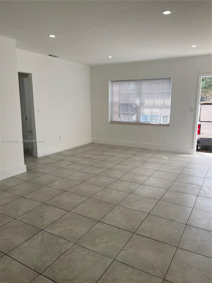 317 East 8th Street, Unit 1 Hialeah, FL 33010 - Photo 20 of 21 a view of an empty room and window