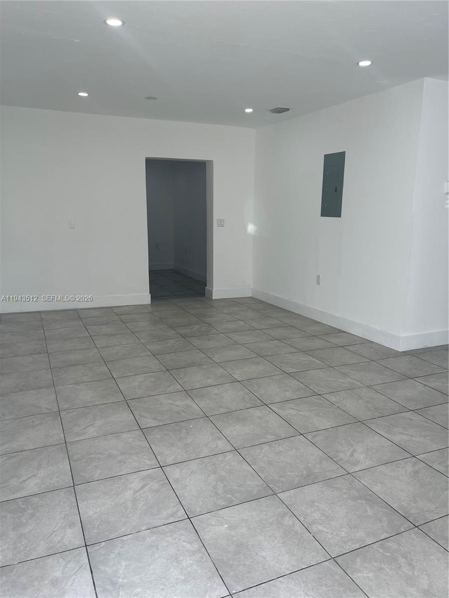 317 East 8th Street, Unit 1 Hialeah, FL 33010 - Photo 9 of 21 a view of an empty room with a window