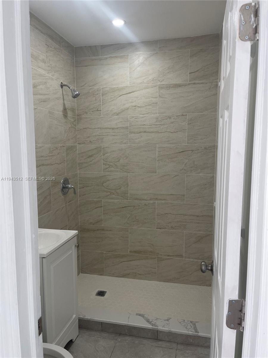 317 East 8th Street, Unit 1 Hialeah, FL 33010 - Photo 10 of 21 a bathroom with a shower
