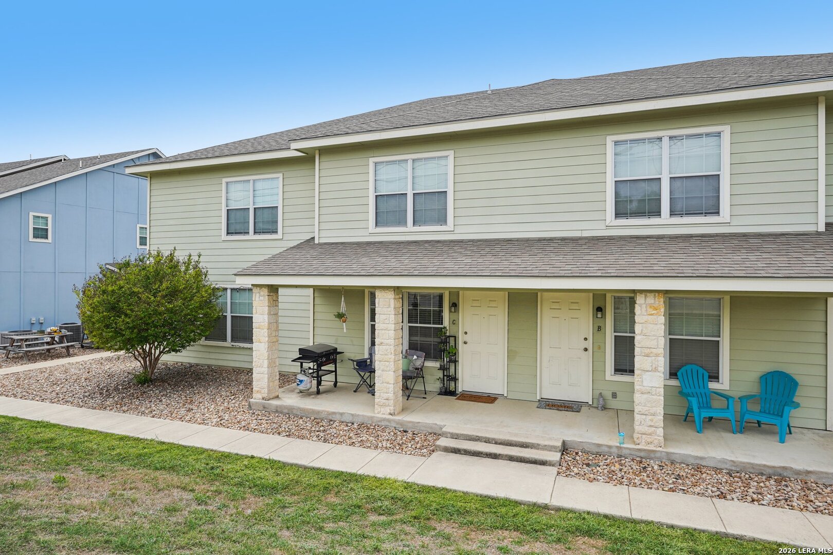2312 Sailing Way, Unit C Kerrville, TX 78028 - Photo 26 of 26 a view of a house with backyard and chairs