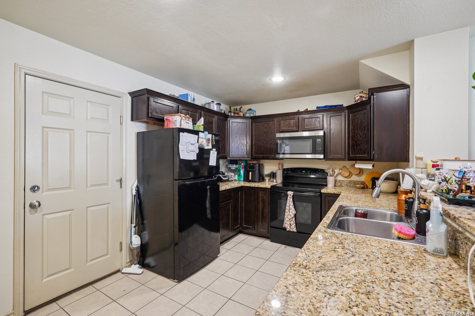 2312 Sailing Way, Unit C Kerrville, TX 78028 - Photo 10 of 26 a kitchen with a refrigerator sink and microwave