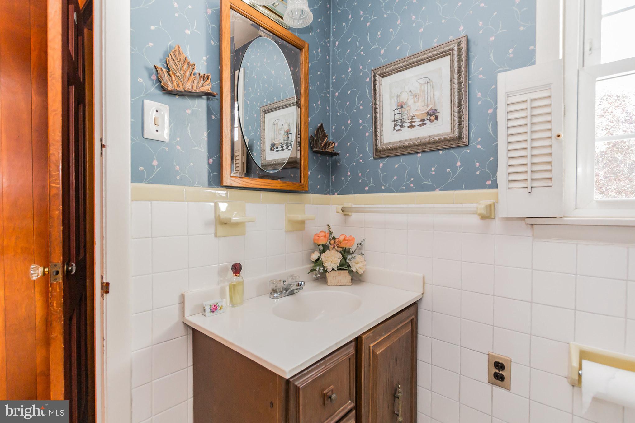 2009 Dayton Street Silver Spring, MD 20902 - Photo 14 of 30 a bathroom with a sink and a mirror