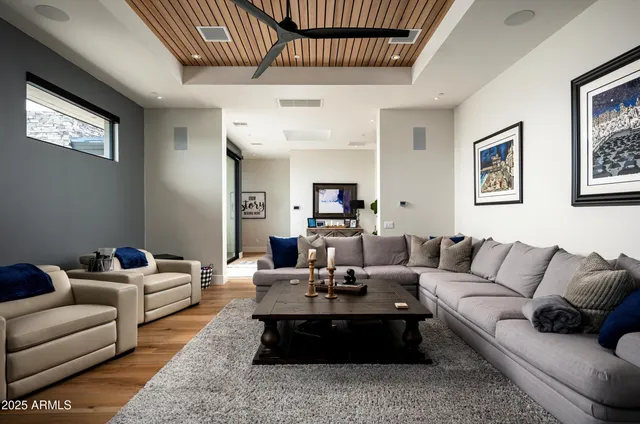 a backyard of a house with outdoor seating