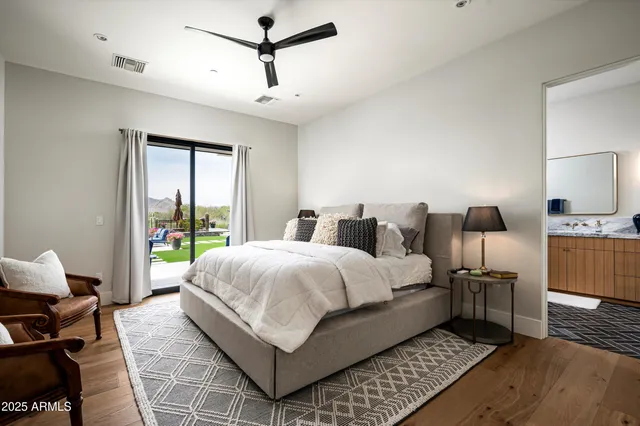 a view of a patio with couches potted plants and a big yard