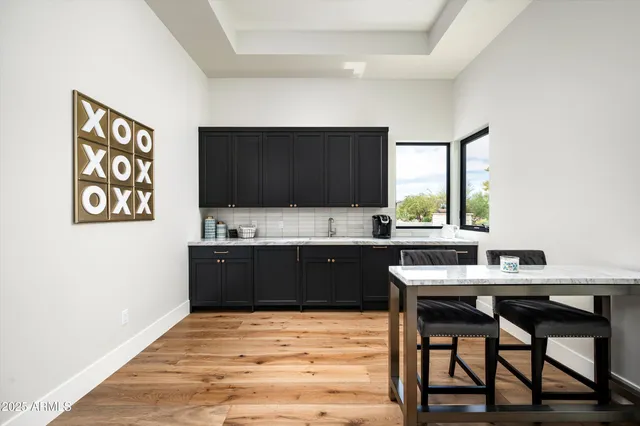 a view of a porch with furniture and a potted plant