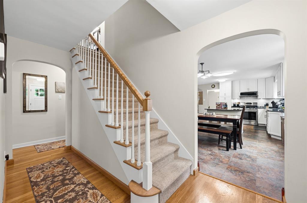 1820 Kent Road Pittsburgh, PA 15241 - Photo 5 of 50 Entryway shows the hallway that will take you to the primary suite and behind the stairs is how you navigate to the finished lower level.