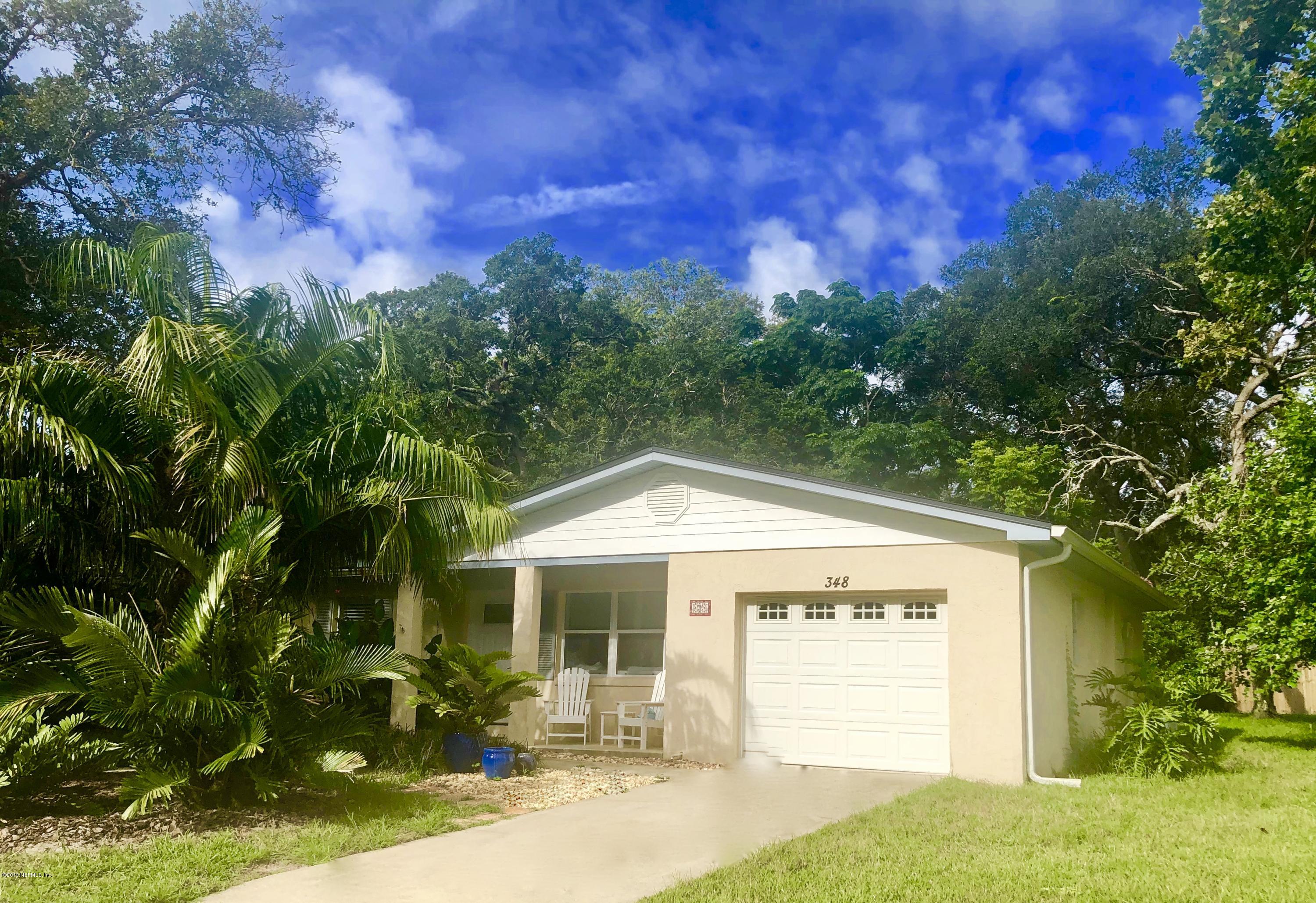348 Jasmine Road St. Augustine, FL 32086 - Photo 1 of 15 a front view of a house with garden