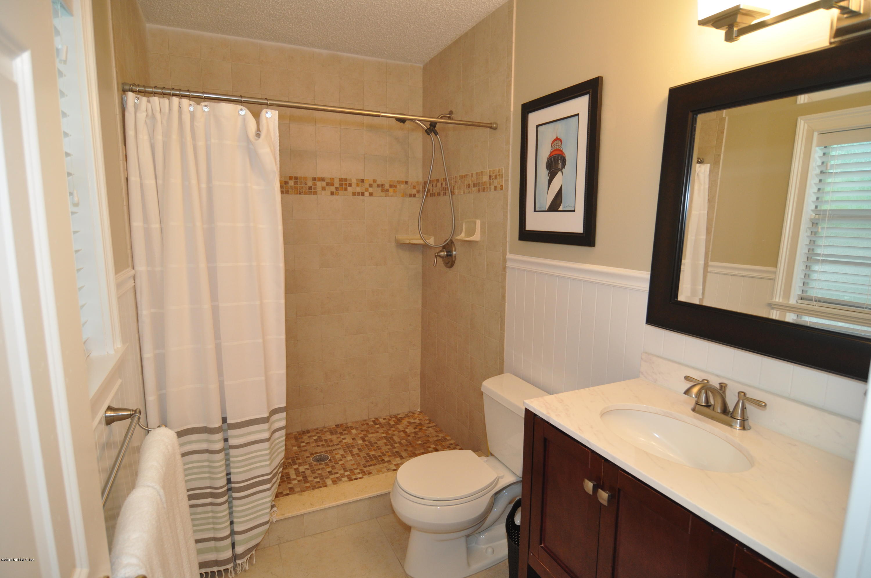 348 Jasmine Road St. Augustine, FL 32086 - Photo 13 of 15 a bathroom with a sink toilet and shower