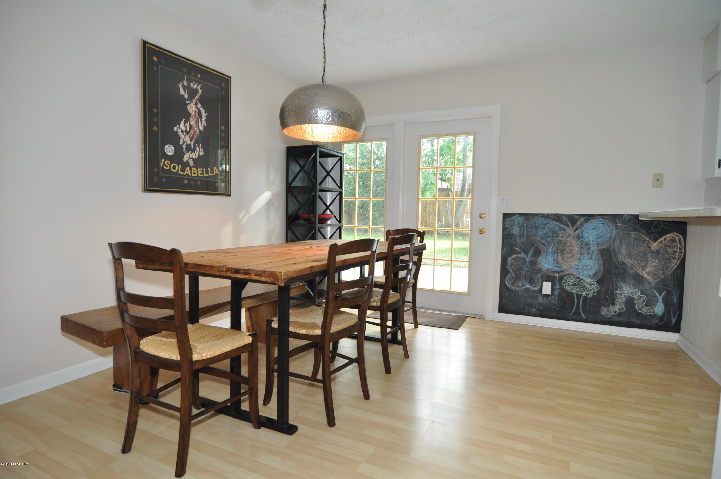 348 Jasmine Road St. Augustine, FL 32086 - Photo 4 of 15 a view of a dining room with furniture window and wooden floor