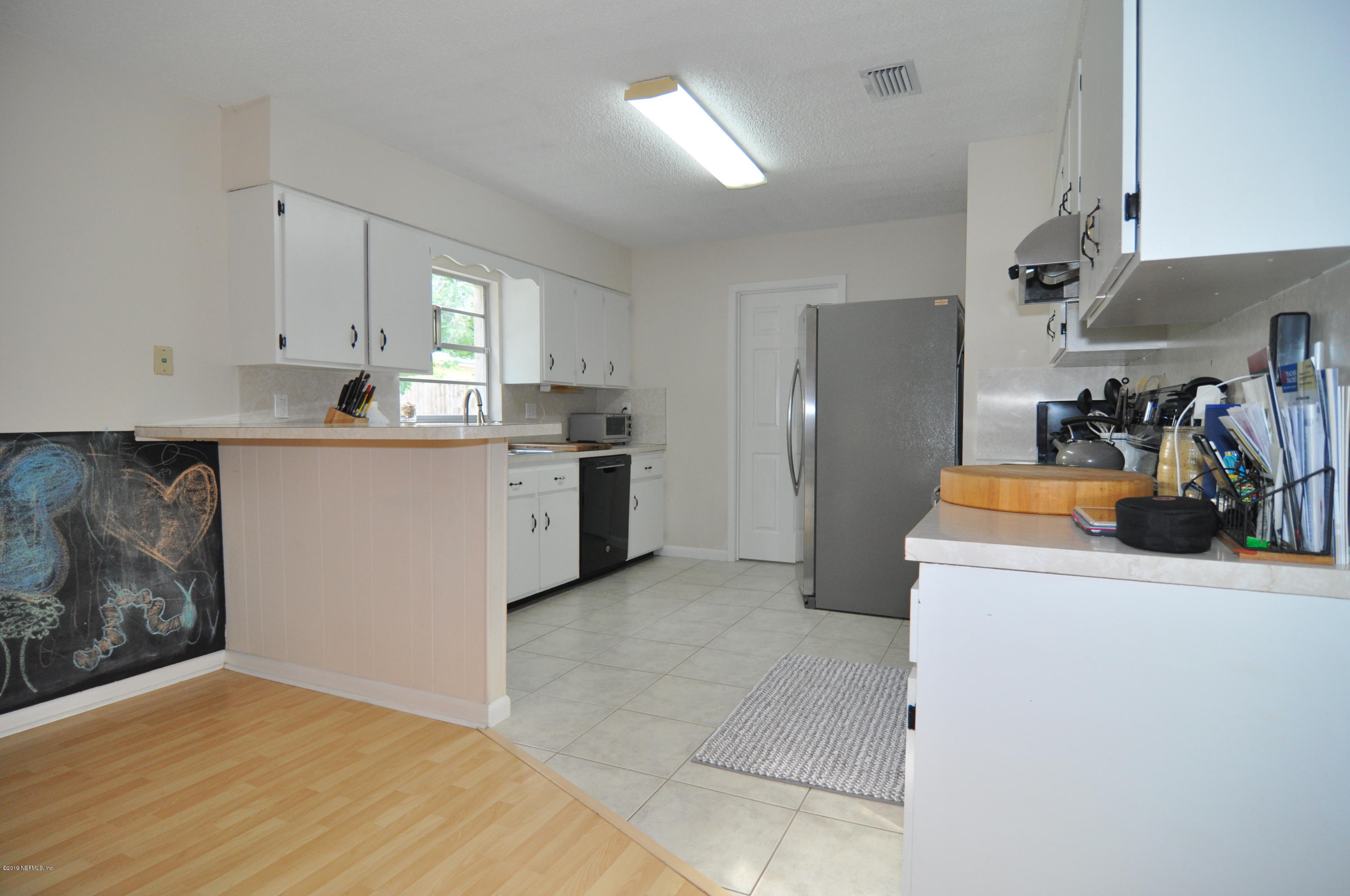 348 Jasmine Road St. Augustine, FL 32086 - Photo 5 of 15 a kitchen with stainless steel appliances granite countertop a refrigerator and a stove