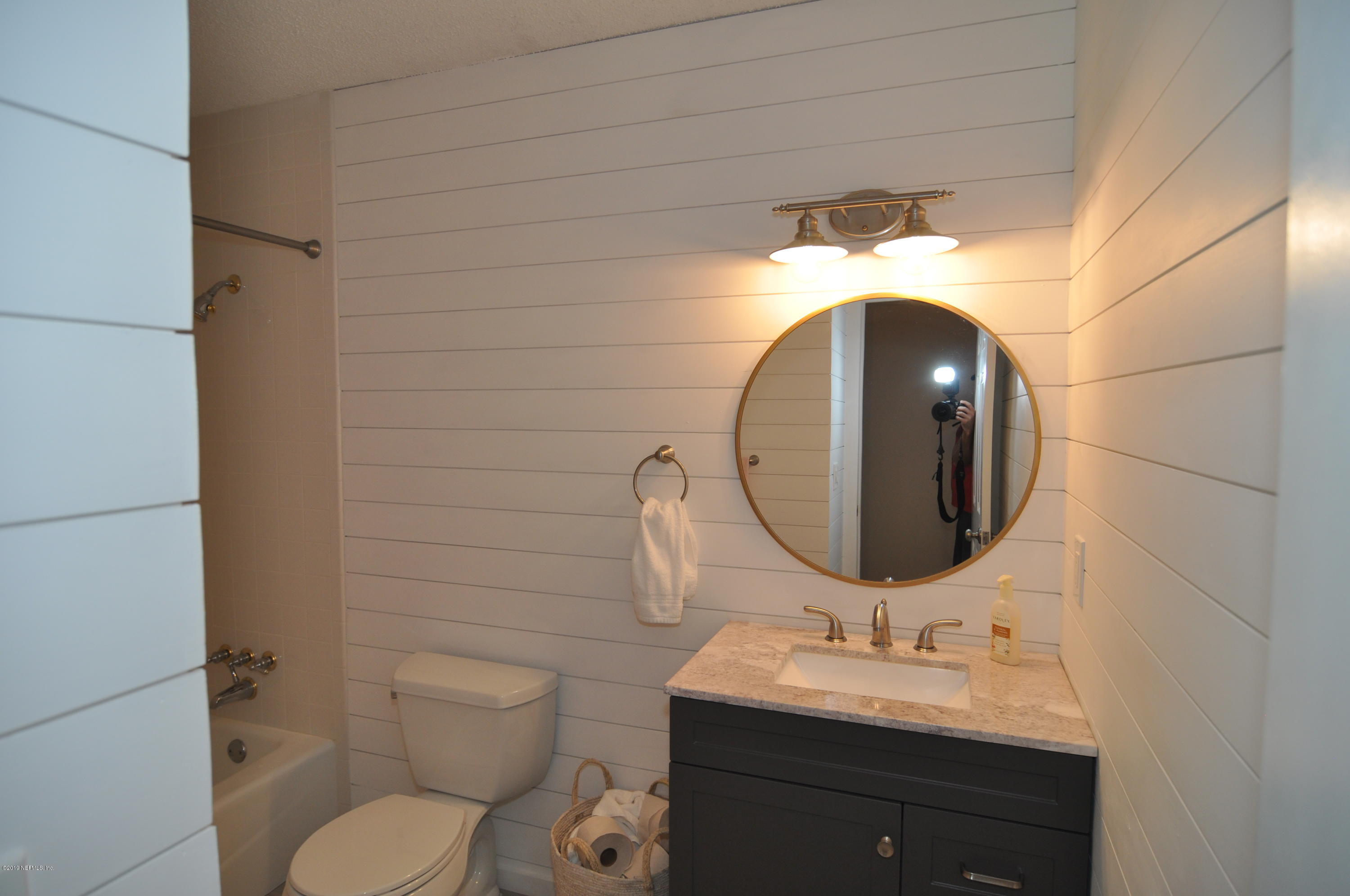 348 Jasmine Road St. Augustine, FL 32086 - Photo 7 of 15 a bathroom with a toilet sink and mirror