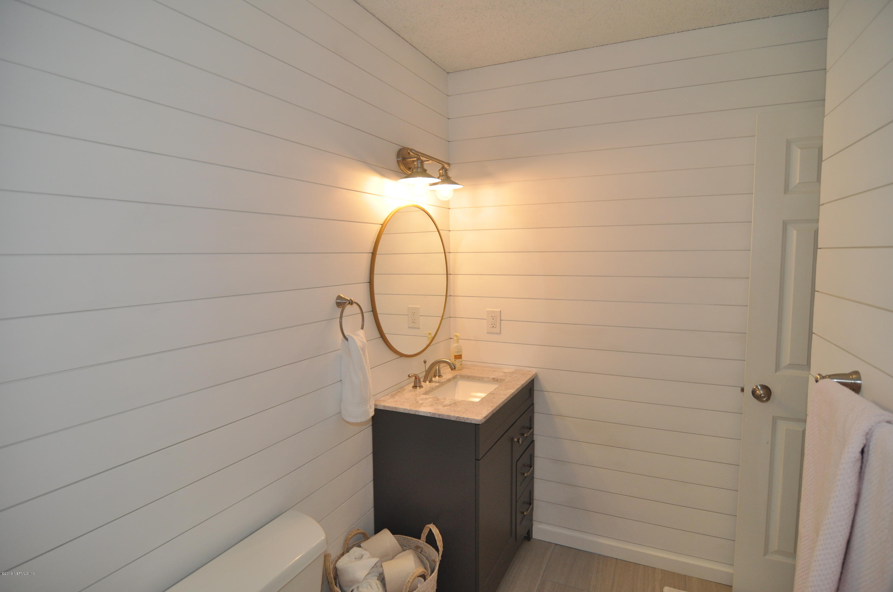 348 Jasmine Road St. Augustine, FL 32086 - Photo 9 of 15 a bathroom with a sink and mirror