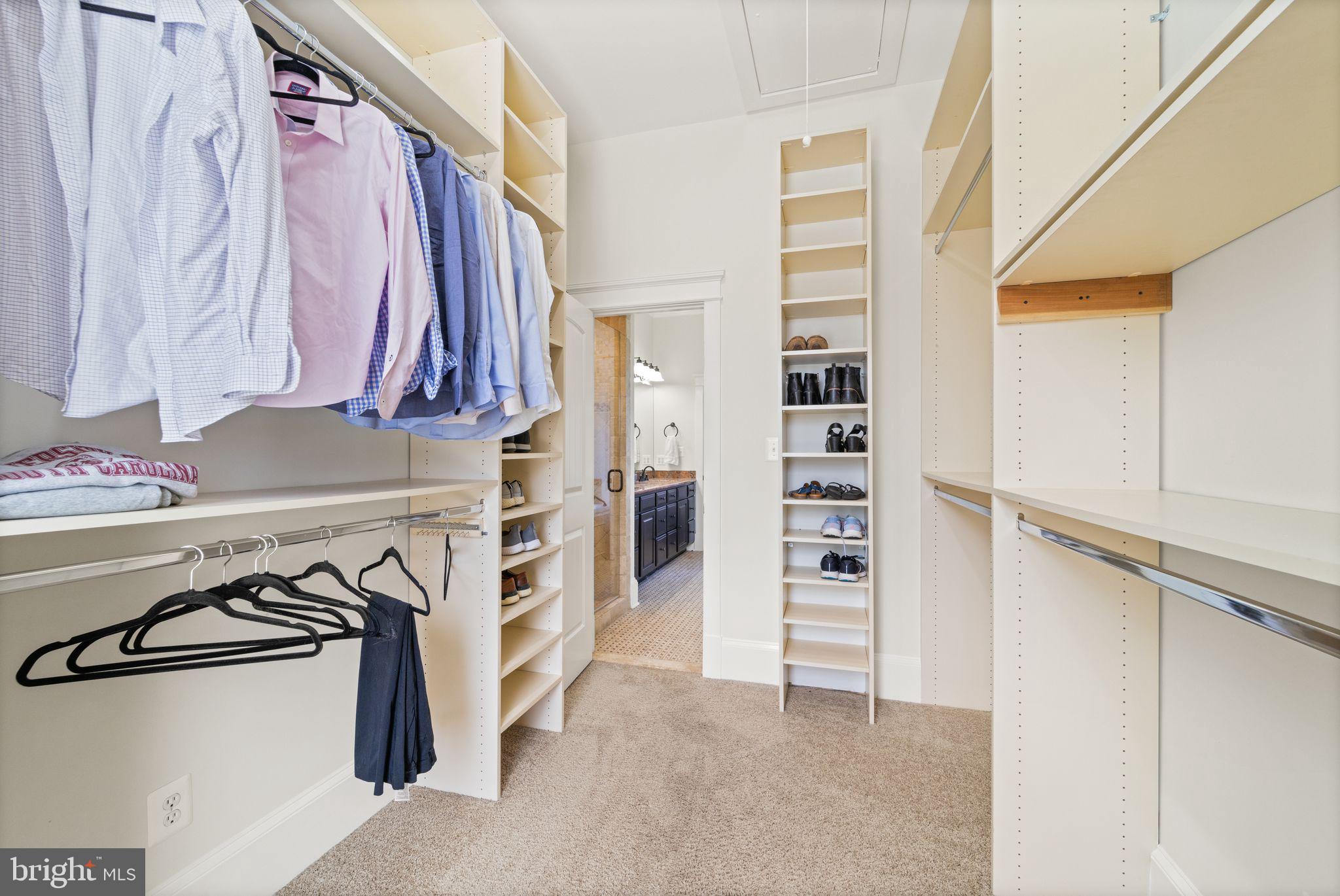 42834 Waxpool Road Ashburn, VA 20148 - Photo 41 of 128 Custom closet system in Primary bedroom closet.
